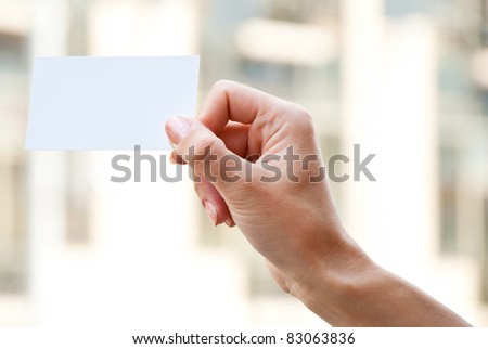 empty card in a hand on a blur background