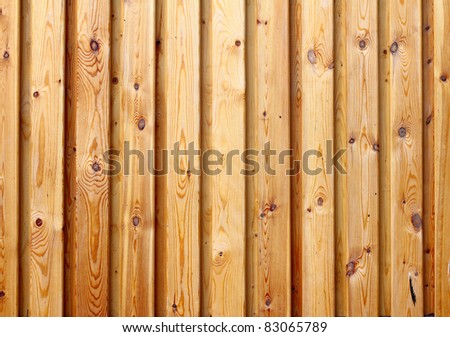Pine wooden old fence. A building background