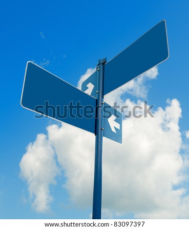 Blank blue road signs in bright sky, clipping path.