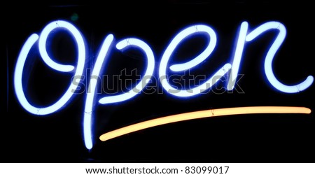 neon shining signboard with word "open" in blue and yellow at night