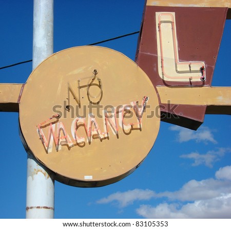 neon no vacancy sign on old roadside motel