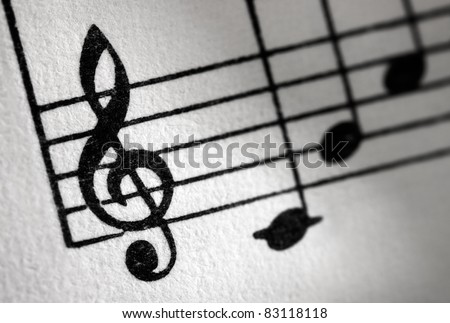 Treble clef and music sheet, diagonal image formation.