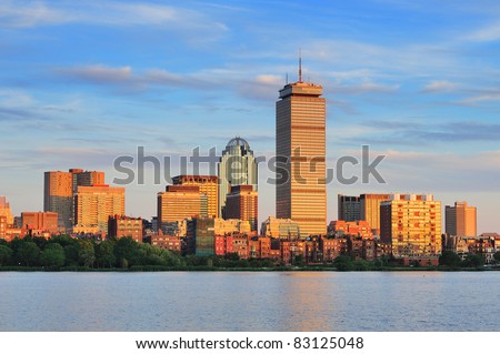 Boston city skyline with Prudential Tower and urban skyscrapers over Charles River.