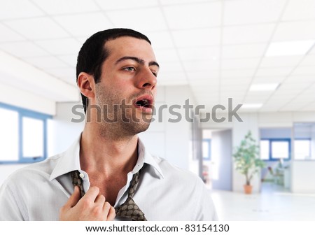 Employee sweating in a warm office Royalty-Free Stock Photo #83154130