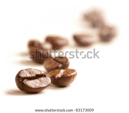 Coffee Beans draw a zigzag line isolated on white. Soft focus.