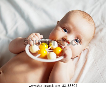 Picture of the newborn resting on a bed