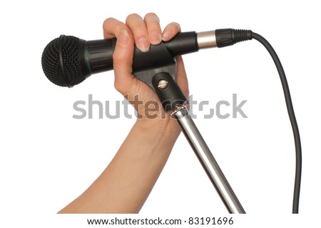 woman holding big black microphone for singing