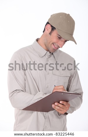 Delivery worker checking clipboard