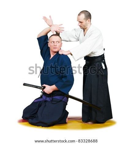 Two jujitsu fighters sportsmen at unarmed combat technique training on mat