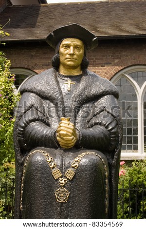 Bronze statue of the Tudor politician, considered by Catholics to be a saint, Sir Thomas More.  Next to Chelsea Old Church, London.  Sculpted by L Cubitt Bevis, erected 1969.