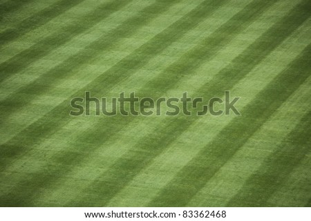 Horizontal shot of manicured outfield grass at a baseball stadium. Royalty-Free Stock Photo #83362468