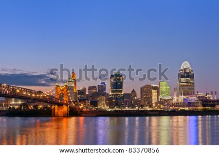 Cincinnati skyline. Image of Cincinnati and John A. Roebling suspension bridge at twilight.