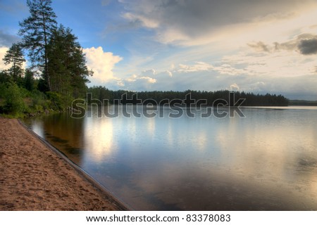 Rain over a lake in Sweden, hdr, made of 3 pictures