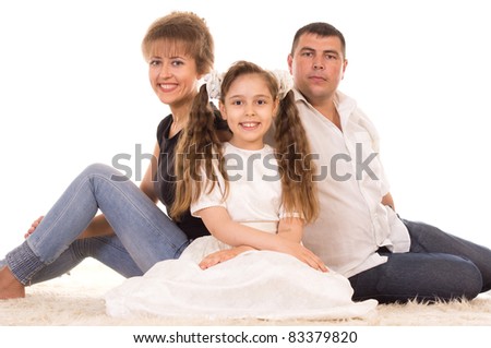 portrait of a cute family on a carpet