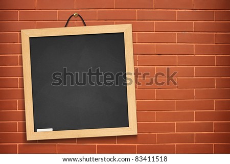 blackboard on orange wall background