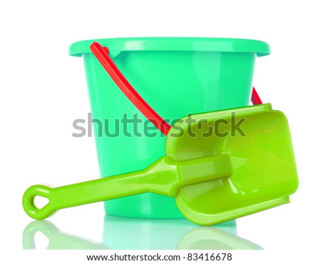 baby toy bucket and shovel isolated on white