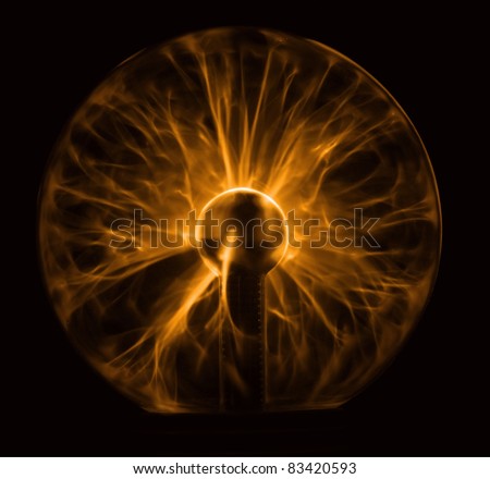 Golden plasma ball glowing in the dark