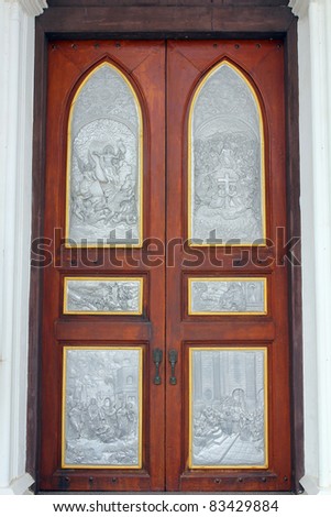 Jesus picture on silver carve art on door, church in Thailand.