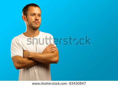 man with a white t-shirt on a blue background