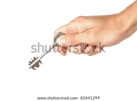 Metal key in the human hand, isolated on the white