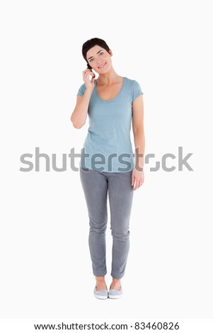 Woman answering the phone against a white background