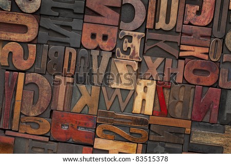 antique letterpress printing blocks with color ink patina, random collection of different size and style