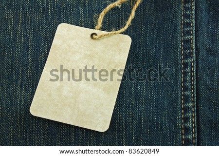 Price tag over jeans background