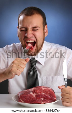 eccentric guy eating red meat Royalty-Free Stock Photo #83642764