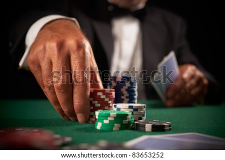 card player gambling casino chips on green felt background selective focus