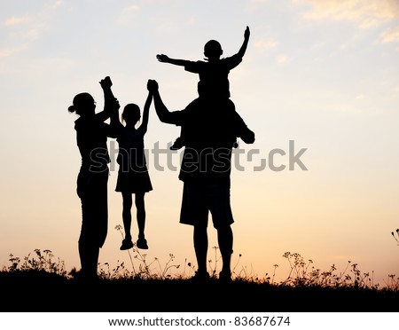 Happy family, boy and girl with mother and father, family at sunset, summertime