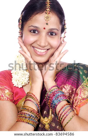 Beautiful young traditional woman against white background