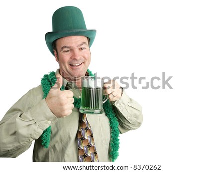 Drunk man with green beer on St. Patrick's Day.  White background with copyspace.