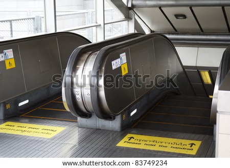There are many warning markings on subway entrance to avoid accident from escalator in Thailand