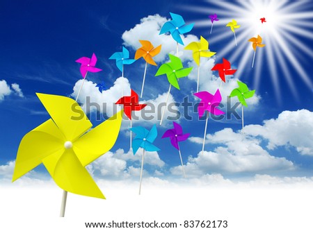 a lot colorful toy pinwheel on blue sky background