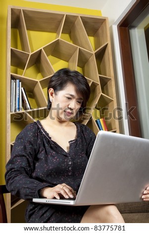 use laptop, asian woman using laptop for work.