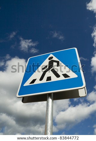 Crosswalk road sign on a sky background