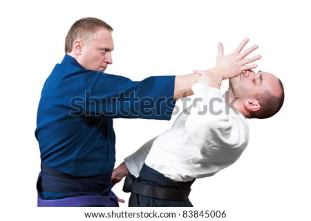 Two jujitsu fighters sportsmen at unarmed combat technique training on mat
