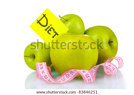 ripe green apples and measuring tape isolated on white
