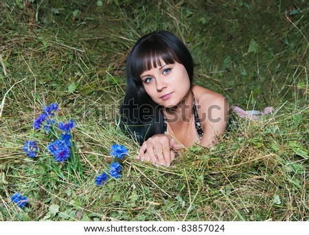 The young woman relaxing on hayloft