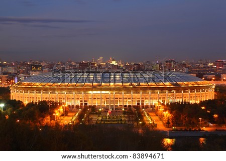 Illuminated Luzhniki Stadium at evening, panorama of Moscow from Vorobyovy Hills Royalty-Free Stock Photo #83894671