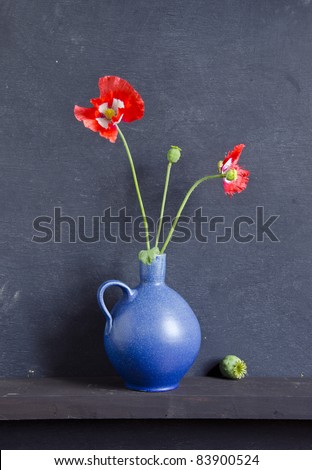 still-life with blue vase and poppy blossoms