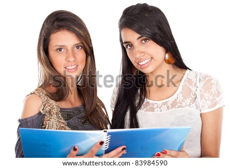 Two active happy teenage girls with notebooks on a white background