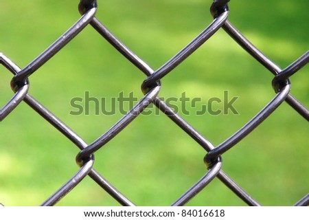 iron wire fence isolated on green background