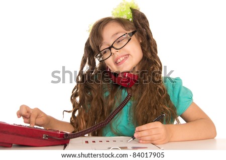 portrait of a little girl working at table