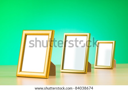 Wooden picture frames on the gradient background