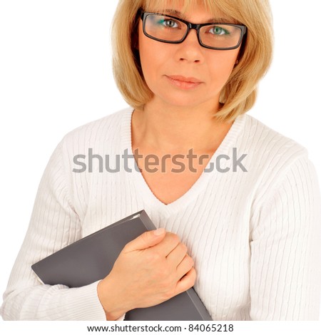 Portrait of a young attractive business woman holding folder with files in her arms and looking at camera. Isolated on white background