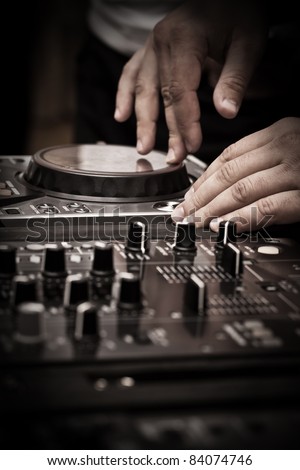 DJ play music with music mixer Royalty-Free Stock Photo #84074746