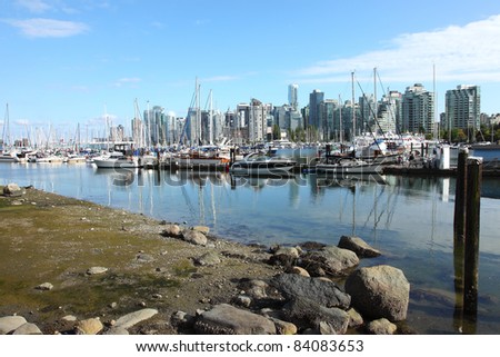A marina and skyline view of Vancouver BC Canada.