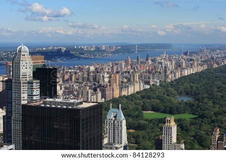 Photo of Central Park and Upper West Side with the George Washington Bridge in the background.