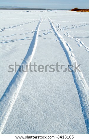 Abstract design - tire tracks in snow Royalty-Free Stock Photo #8413105